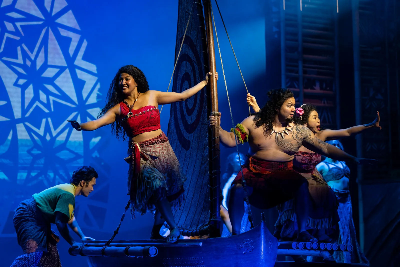 Moana and Maui on a canoe in Disney The Tale of Moana